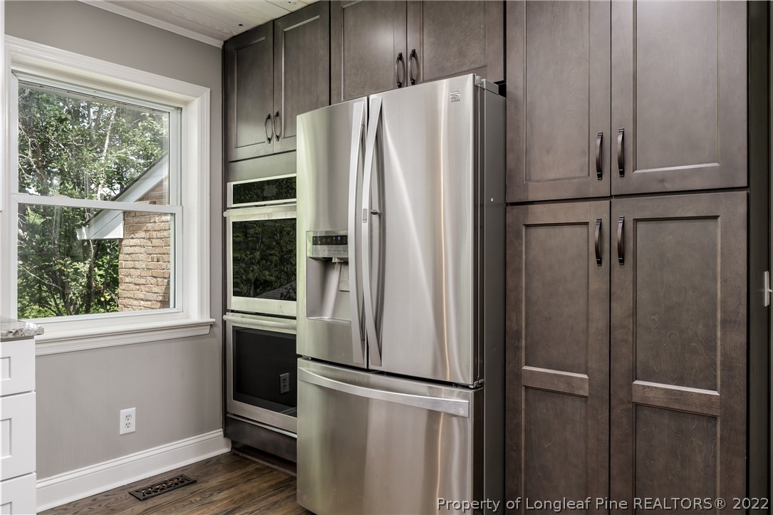 190 Valhalla Road Southern Pines, NC 28387 - Photo 14 of 39 a white refrigerator freezer and a window in a kitchen