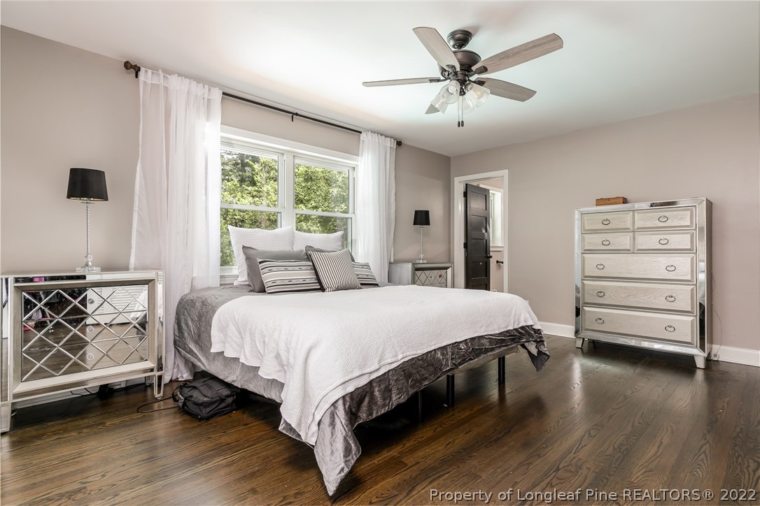 190 Valhalla Road Southern Pines, NC 28387 - Photo 16 of 39 a bedroom with a bed and a ceiling fan