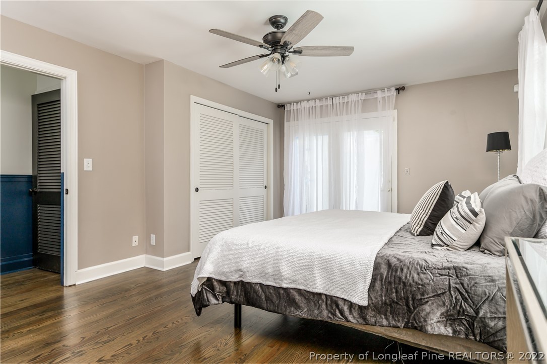 190 Valhalla Road Southern Pines, NC 28387 - Photo 17 of 39 a bedroom with a bed and a ceiling fan