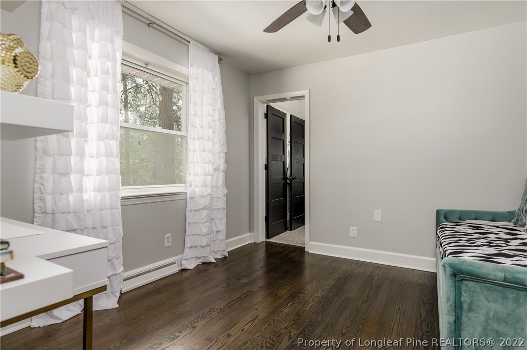 190 Valhalla Road Southern Pines, NC 28387 - Photo 19 of 39 a view of an empty room with a window and wooden floor
