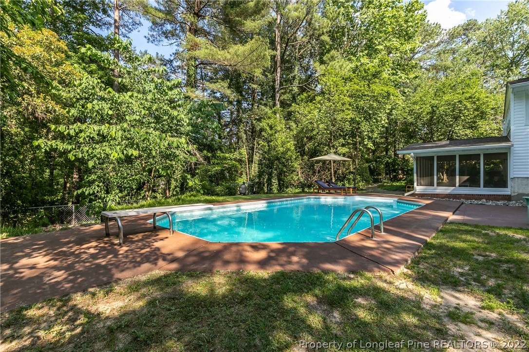 190 Valhalla Road Southern Pines, NC 28387 - Photo 2 of 39 a view of a house with swimming pool