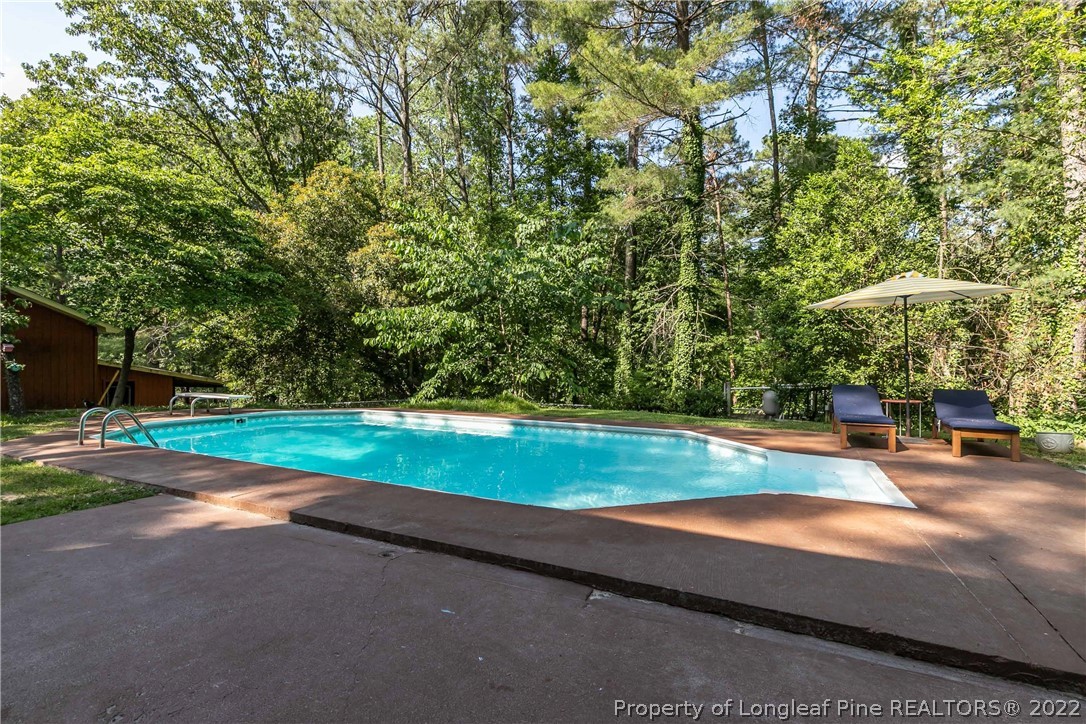 190 Valhalla Road Southern Pines, NC 28387 - Photo 24 of 39 a view of a yard with an outdoor space