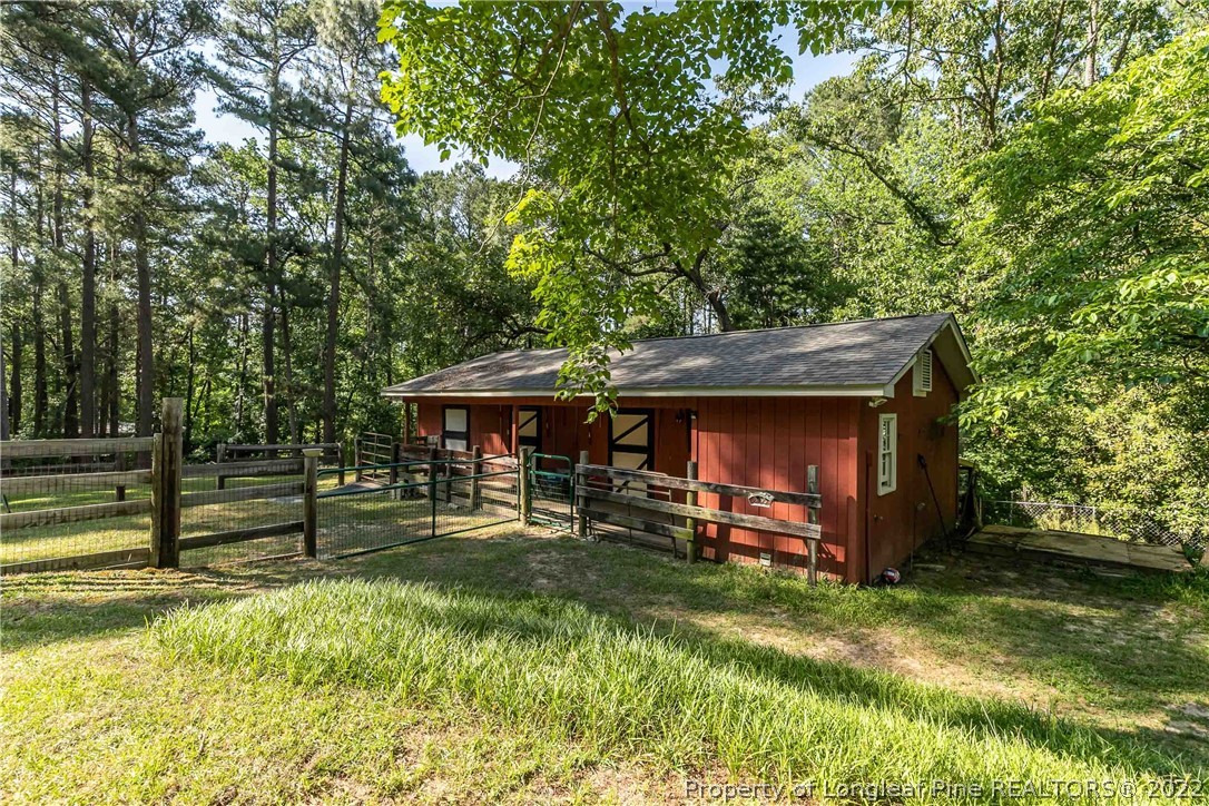 190 Valhalla Road Southern Pines, NC 28387 - Photo 25 of 39 a view of a house with a yard