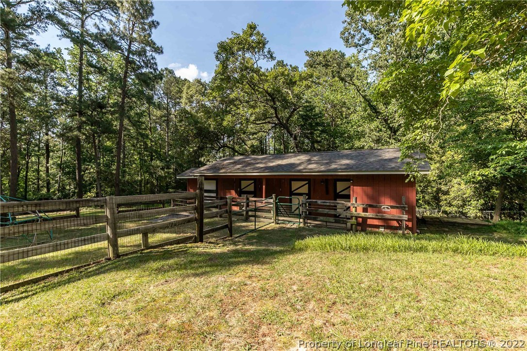190 Valhalla Road Southern Pines, NC 28387 - Photo 26 of 39 a view of a house with pool and sitting area