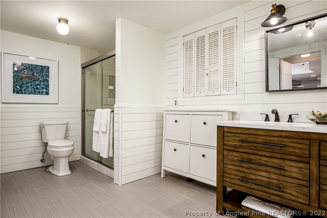 190 Valhalla Road Southern Pines, NC 28387 - Photo 27 of 39 a bathroom with a sink and a mirror