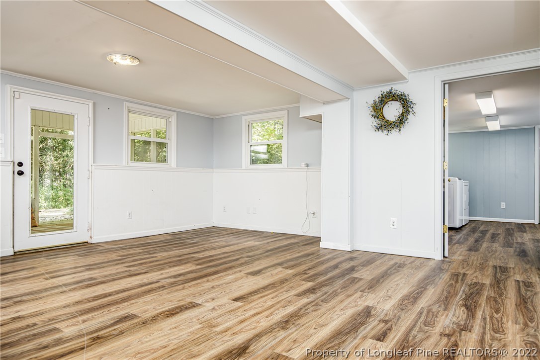 190 Valhalla Road Southern Pines, NC 28387 - Photo 32 of 39 a view of empty room with wooden floor and fan