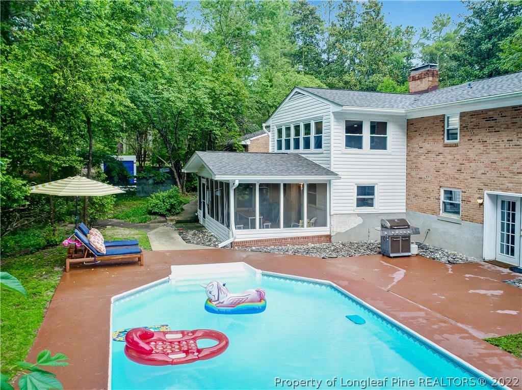 190 Valhalla Road Southern Pines, NC 28387 - Photo 38 of 39 a view of outdoor space yard deck patio and swimming pool