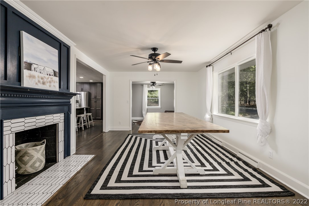 190 Valhalla Road Southern Pines, NC 28387 - Photo 6 of 39 a view of an empty room with a fireplace and wooden floor