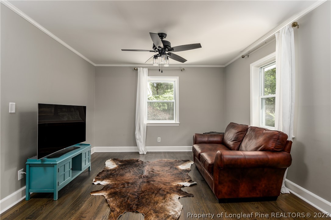 190 Valhalla Road Southern Pines, NC 28387 - Photo 8 of 39 a living room with furniture and a flat screen tv