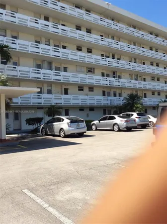 a view of parking with cars parked