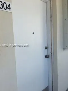 a view of a room with wooden floor and staircase