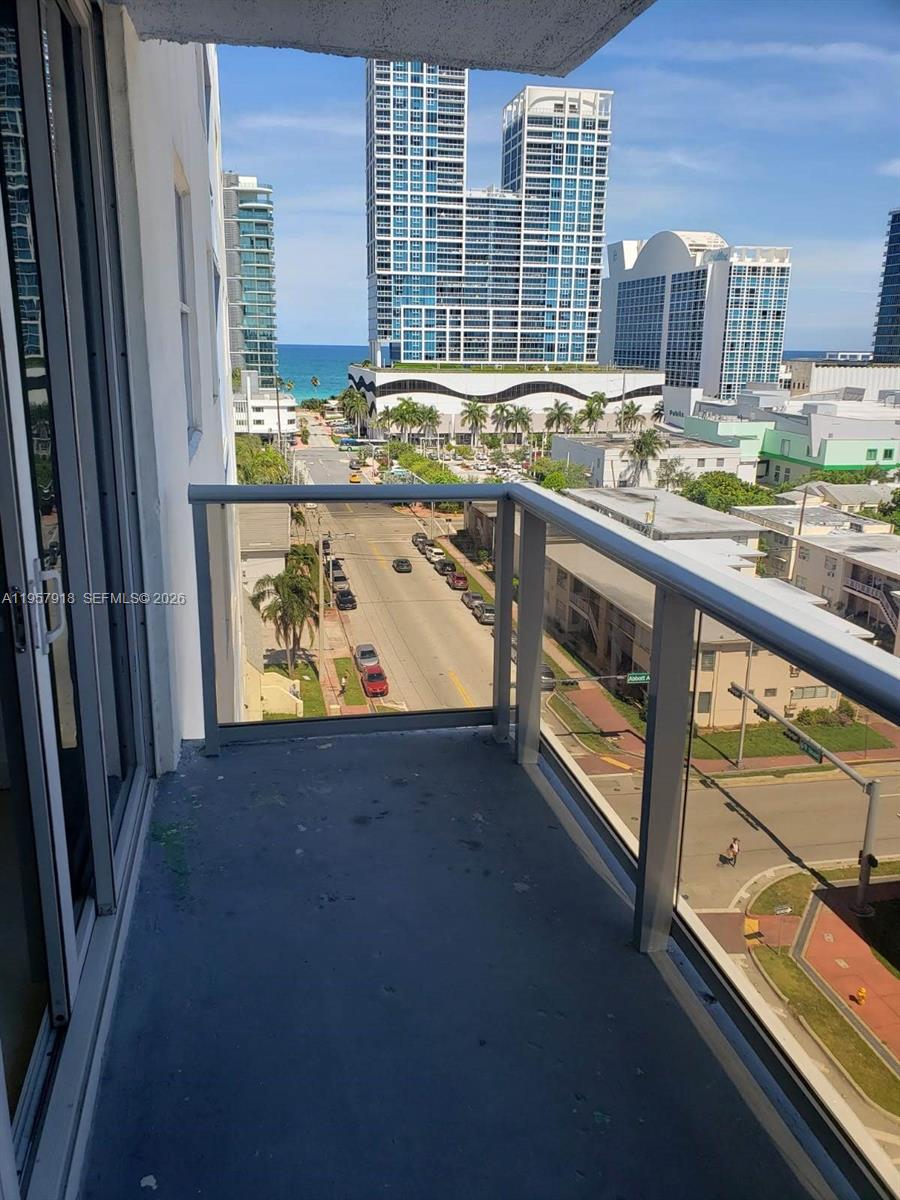 401 69th Street, Unit 906 Miami Beach, FL 33141 - Photo 22 of 24 a view of a kitchen with a sink and dishwasher next to a window