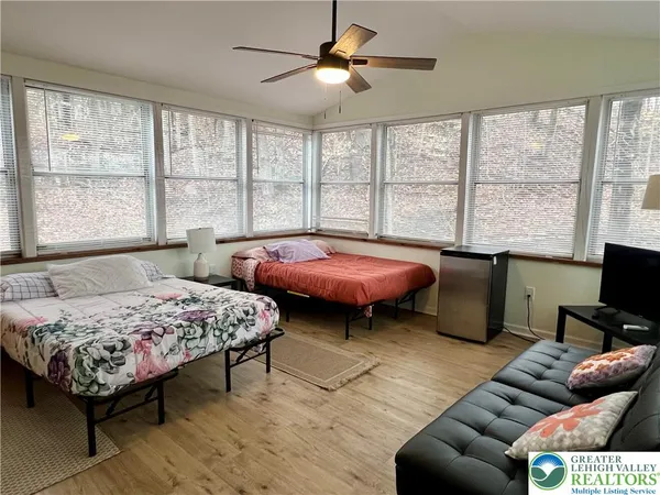 a living room with furniture and a window