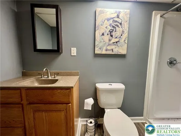 a view of front door with wooden floor