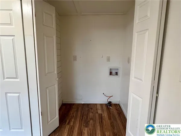 a view of a hallway with front door