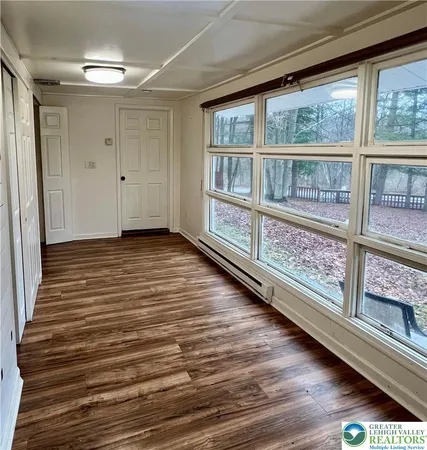 a view of a balcony with wooden floor