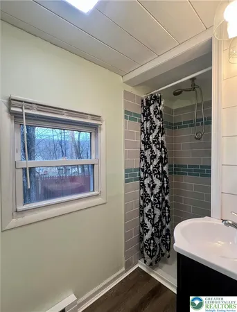 a room with a sink and a mirror