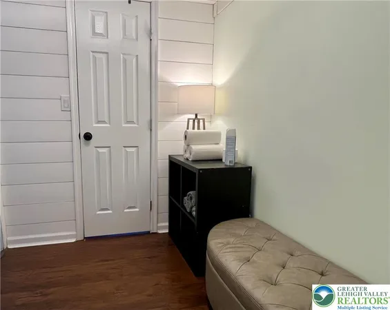 a view of a yard with wooden fence