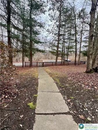 a view of a backyard with sitting area