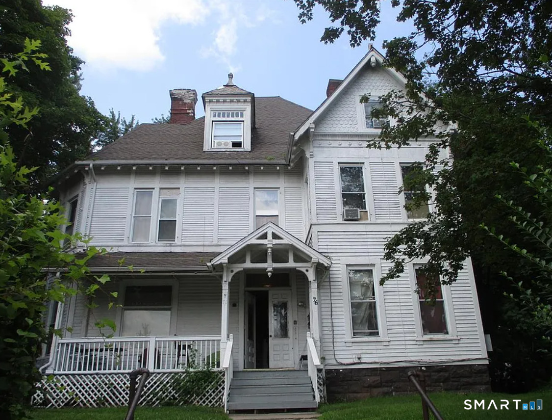 76 Lincoln Street, Unit 1N Meriden, CT 06451 - Photo 1 of 4 a front view of a house with a garden