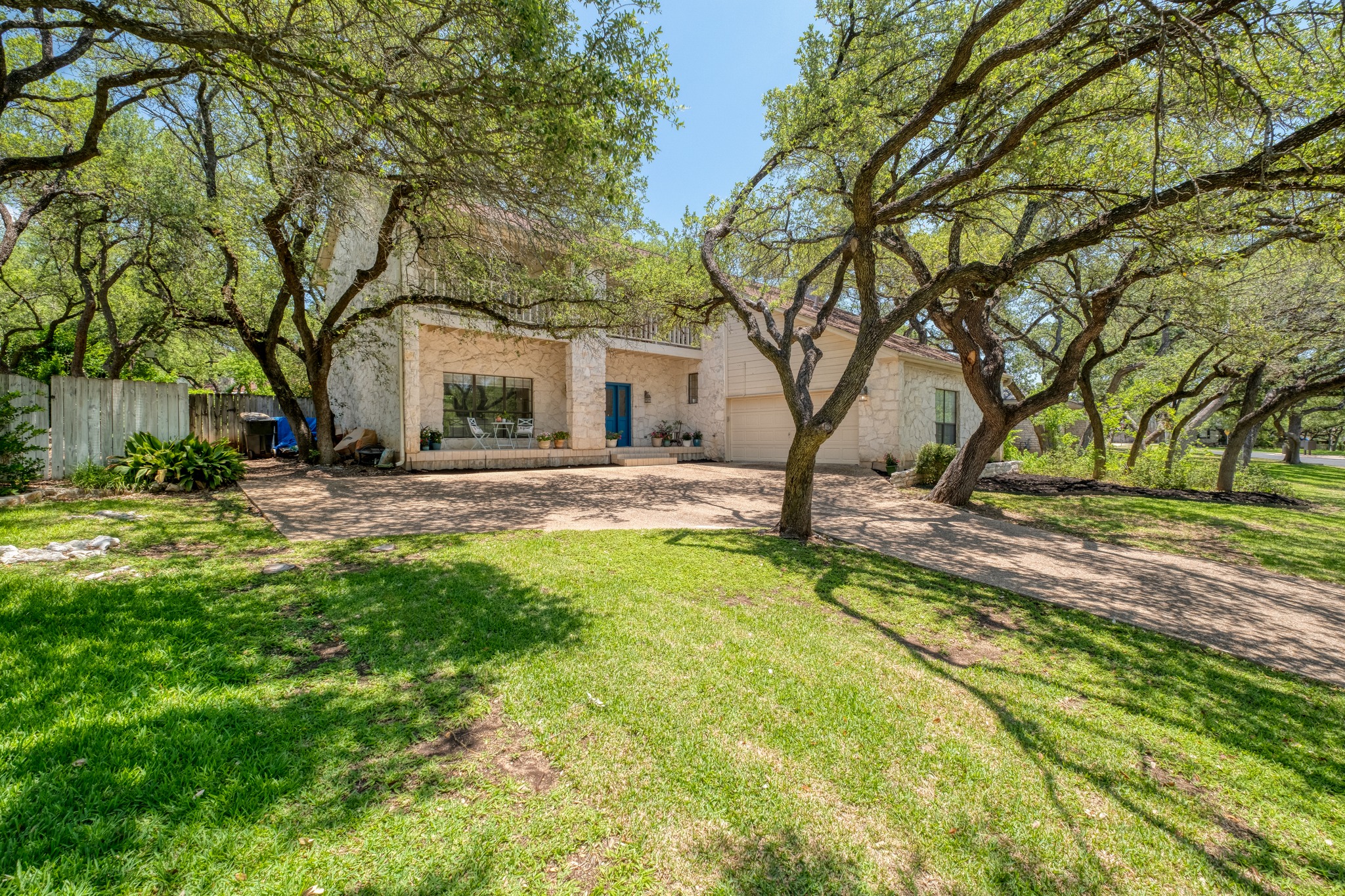 202 Ridgewood Drive Georgetown, TX 78628 - Photo 2 of 40 a yellow house with trees in front of it
