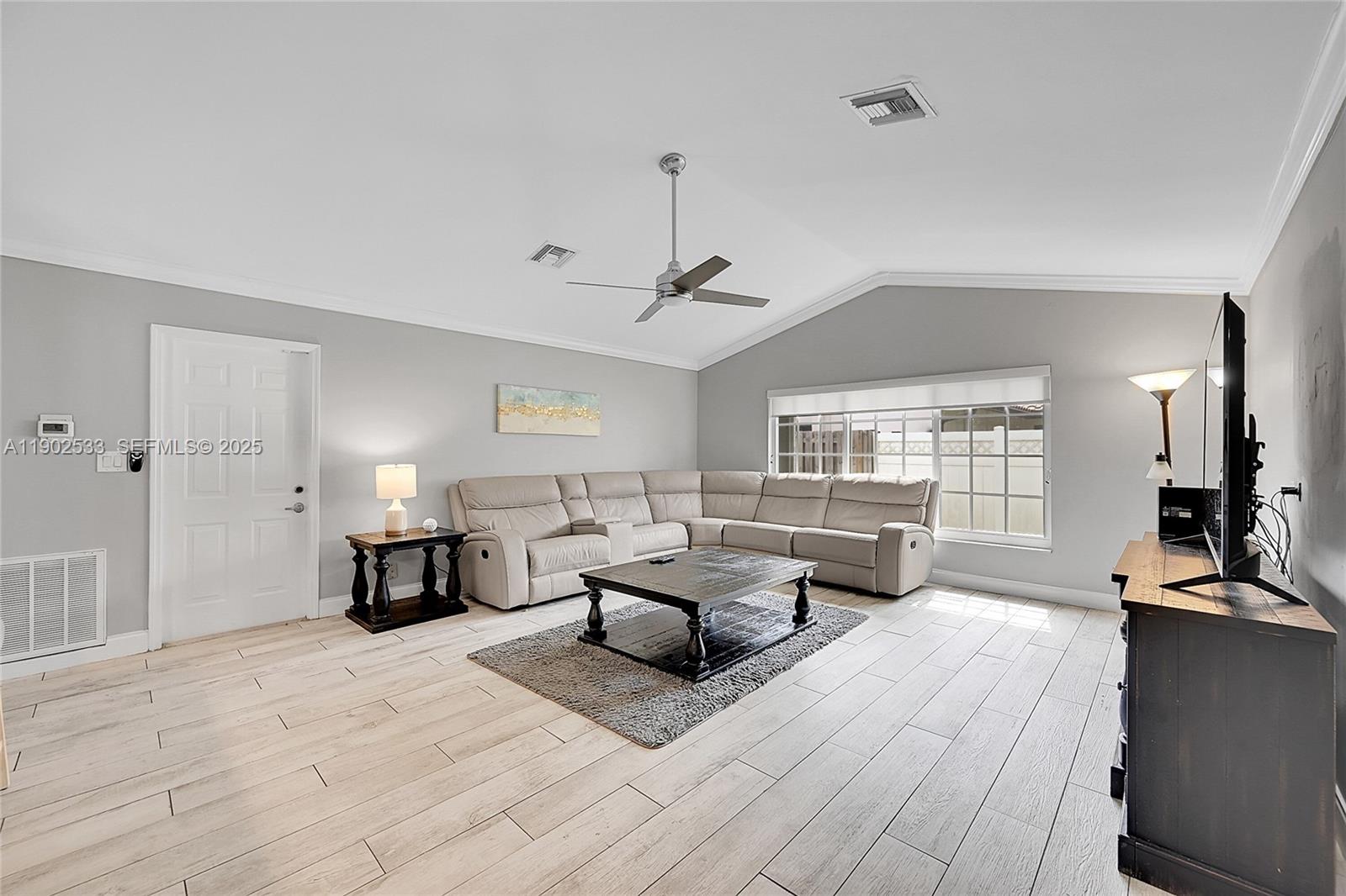 9841 Southwest 1st Street, Unit 9841 Plantation, FL 33324 - Photo 12 of 37 a living room with furniture