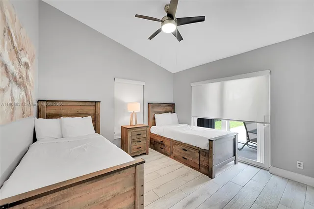 a room with a bed and window