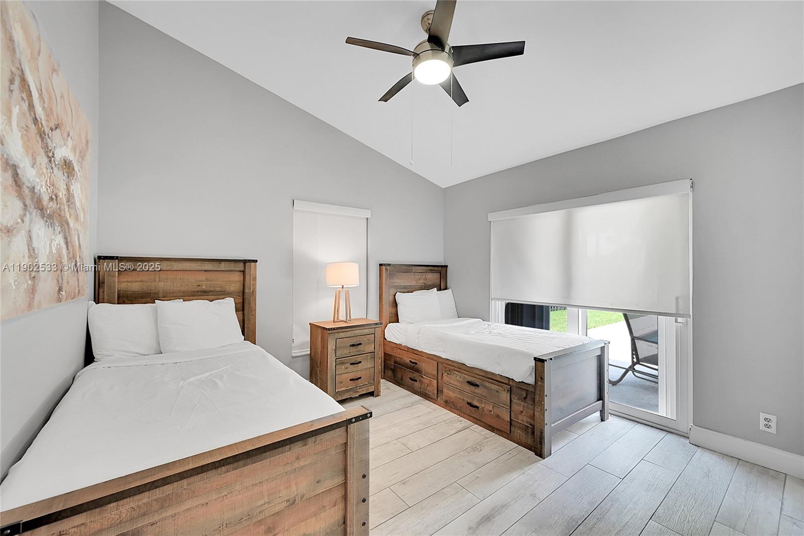 9841 Southwest 1st Street, Unit 9841 Plantation, FL 33324 - Photo 21 of 37 a room with a bed and window