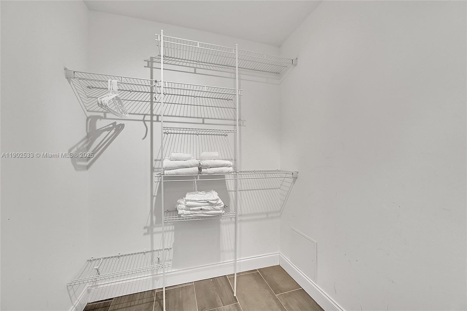 9841 Southwest 1st Street, Unit 9841 Plantation, FL 33324 - Photo 31 of 37 a view of store room with racks on the wall