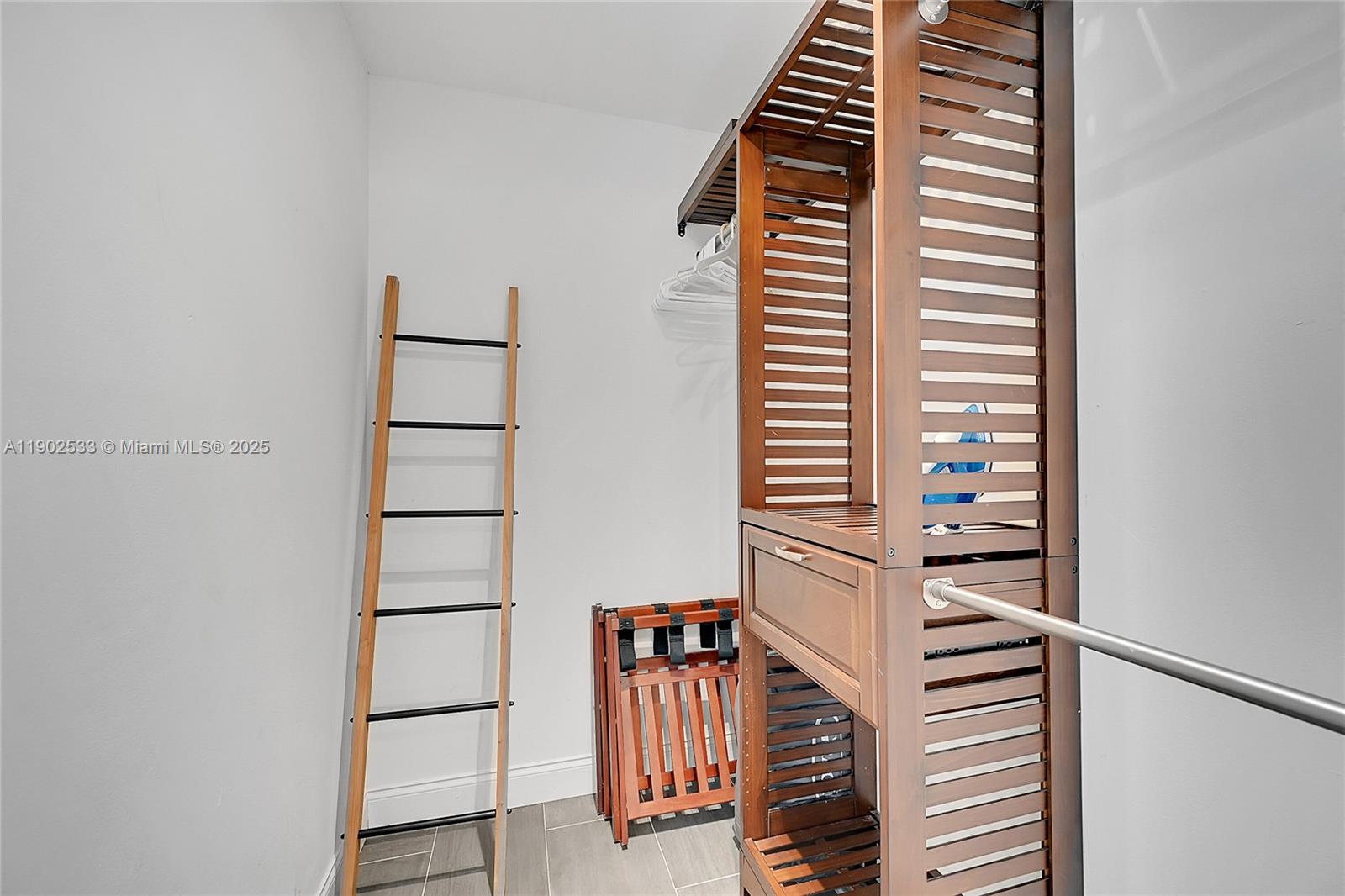 9841 Southwest 1st Street, Unit 9841 Plantation, FL 33324 - Photo 32 of 37 a view of a hallway with stairs