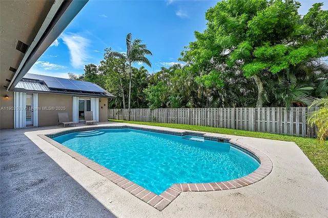 a view of outdoor space and swimming pool