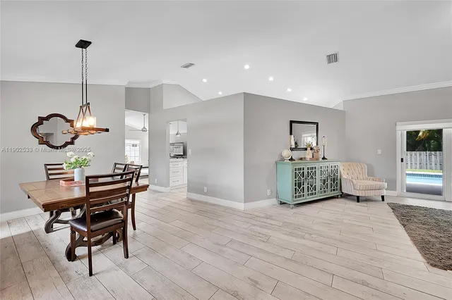 a view of a livingroom with furniture and a window