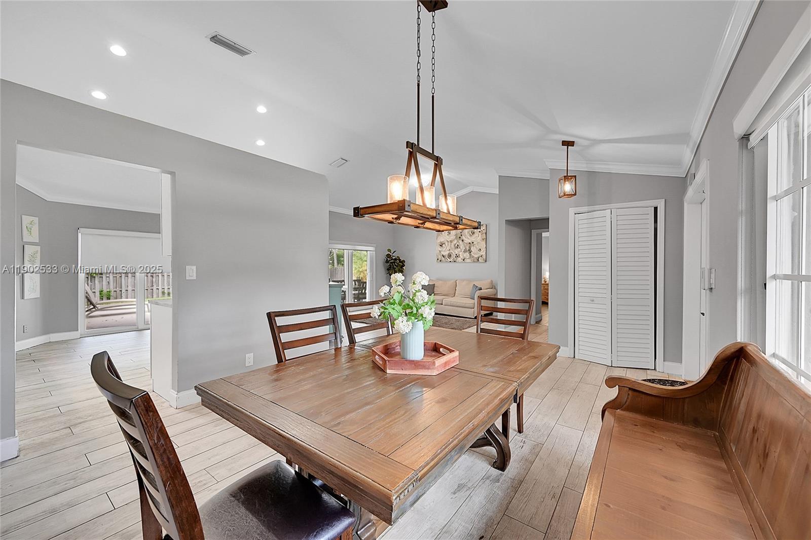 9841 Southwest 1st Street, Unit 9841 Plantation, FL 33324 - Photo 8 of 37 a view of a dining room with furniture