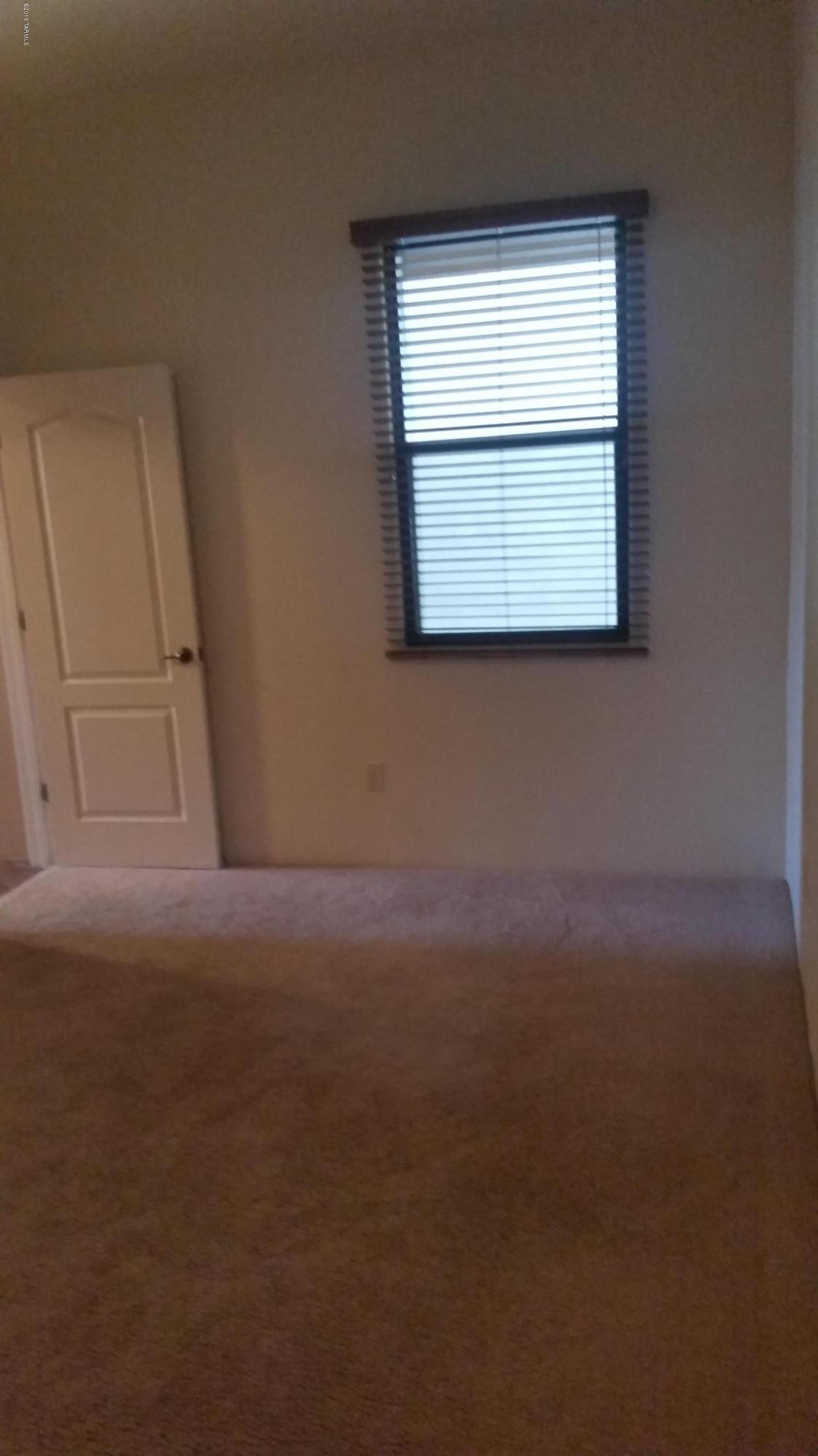 478 East Cedarvale Road Tucson, AZ 85704 - Photo 12 of 39 a view of empty room with window