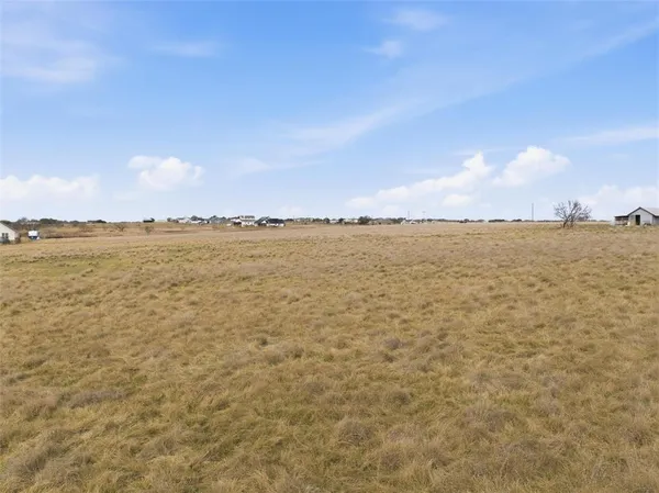 a view of an outdoor space and tennis court