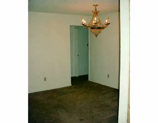 a view of a chandelier in hallway