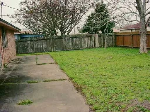 a swimming pool with wooden fence