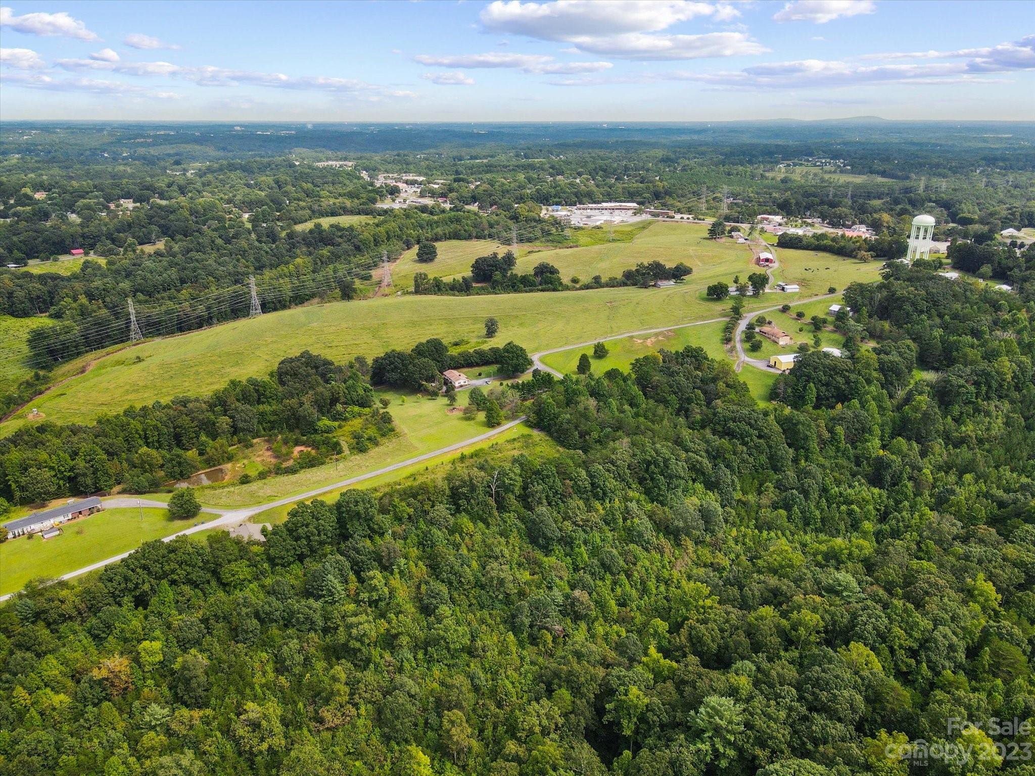 127 None S Hickory Nc 28602 None South, Unit NONE Hickory, NC 28602 - Photo 13 of 18 a view of a city with mountains in the background