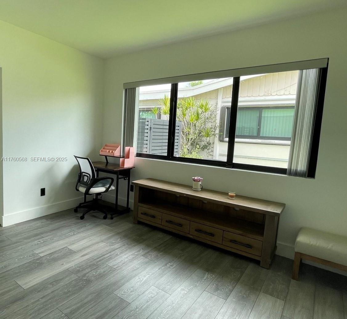 19600 Northeast 19th Avenue Miami, FL 33179 - Photo 24 of 33 a reading room with wooden floor and a window