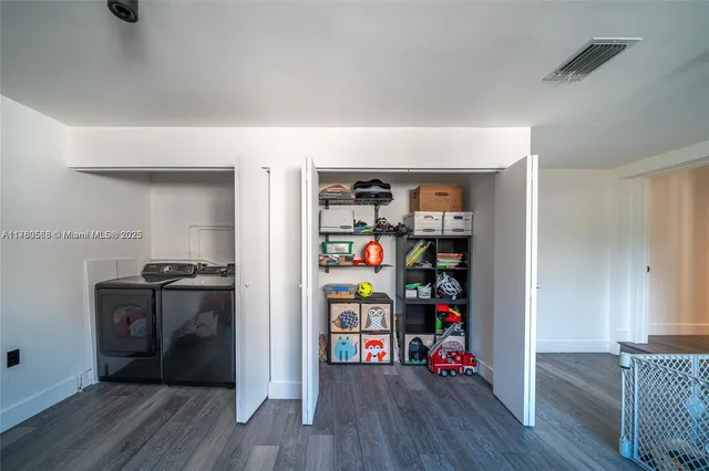 a view of a livingroom with wooden floor