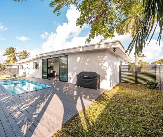 a house view with a backyard space