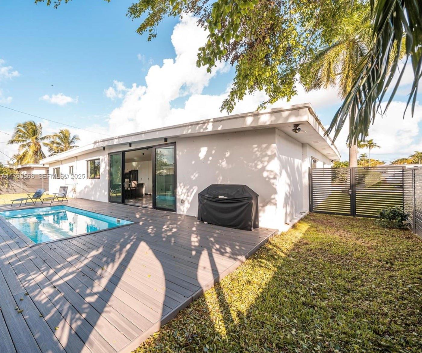 19600 Northeast 19th Avenue Miami, FL 33179 - Photo 29 of 33 a house view with a backyard space