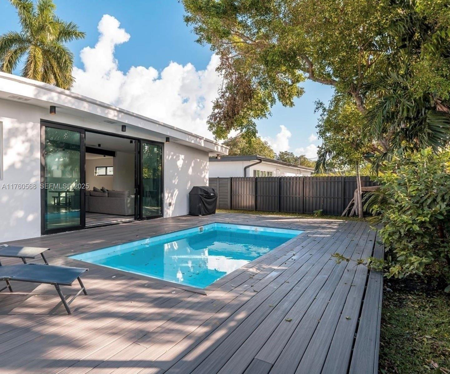 19600 Northeast 19th Avenue Miami, FL 33179 - Photo 30 of 33 swimming pool view with seating space
