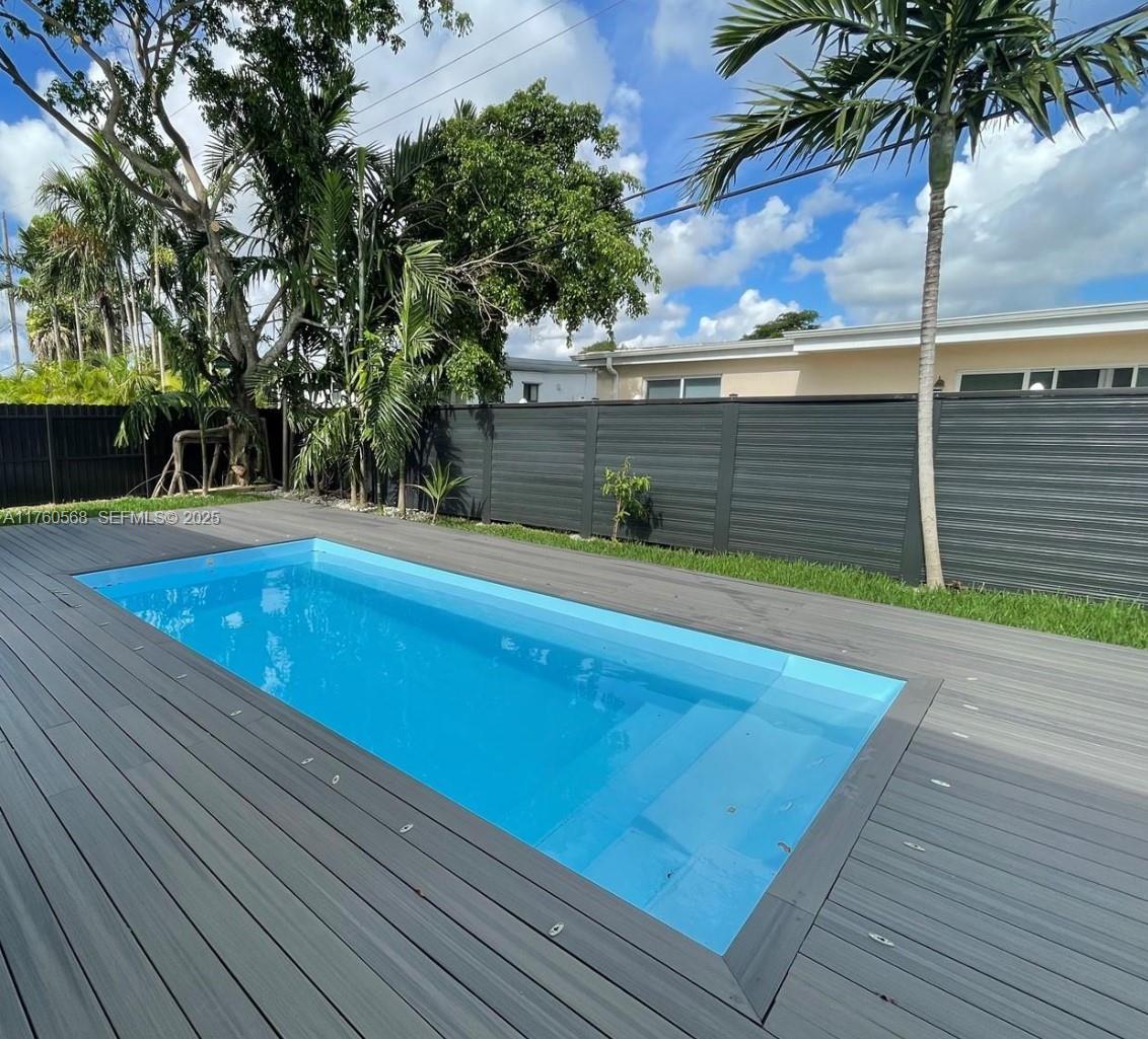 19600 Northeast 19th Avenue Miami, FL 33179 - Photo 31 of 33 a view of a swimming pool with an outdoor space