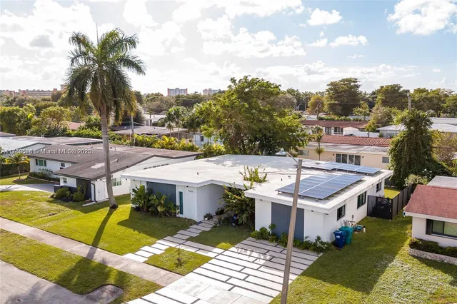 an aerial view of a house with a swimming pool