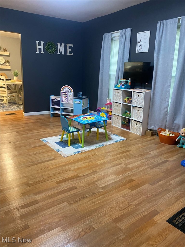 408 Broad State Road Conneaut, OH 44030 - Photo 11 of 39 Recreation room with light wood-style floors and plenty of natural light