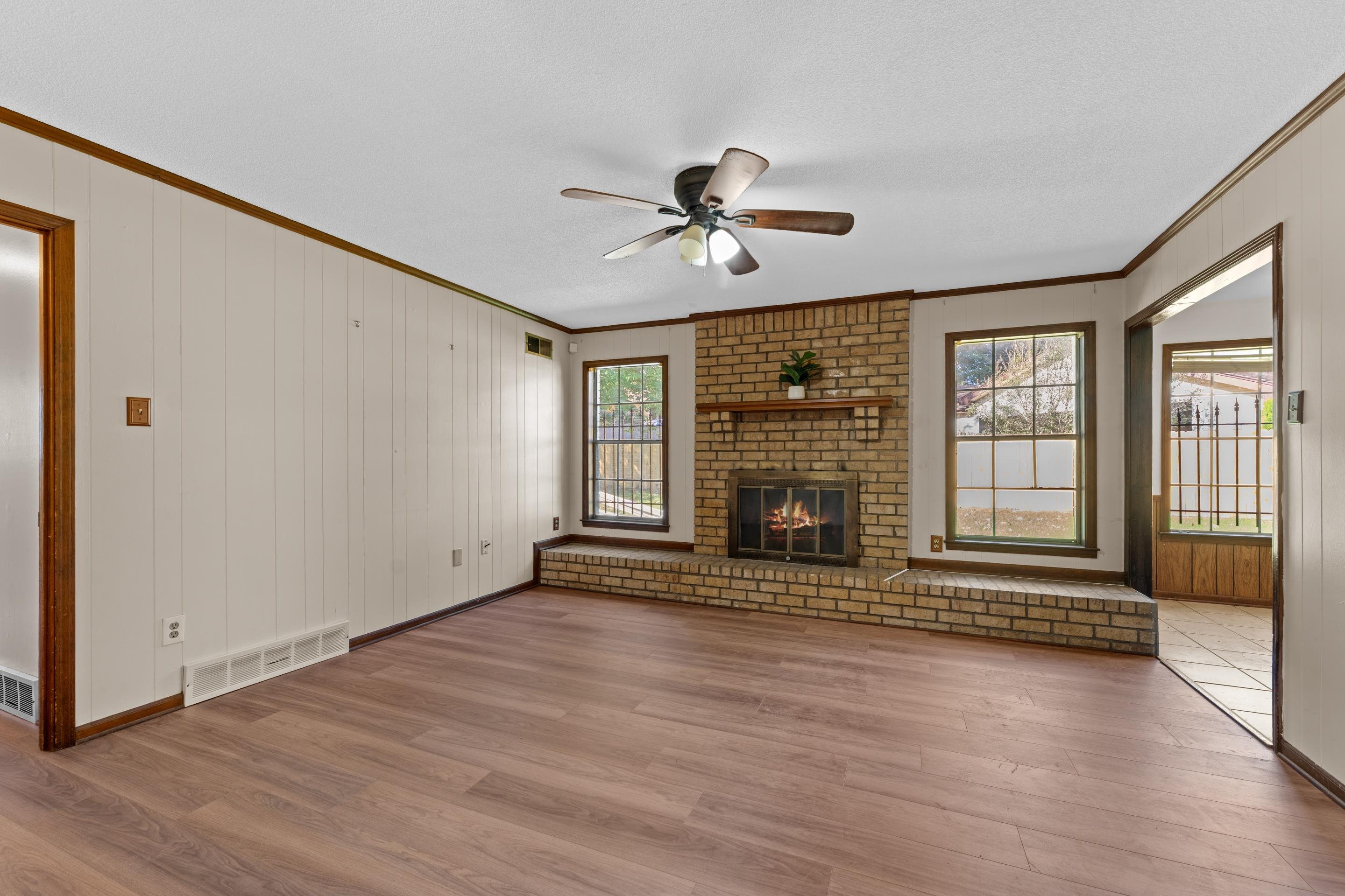 3095 Spring Hill Cove Memphis, TN 38127 - Photo 13 of 29 an empty room with wooden floor and windows