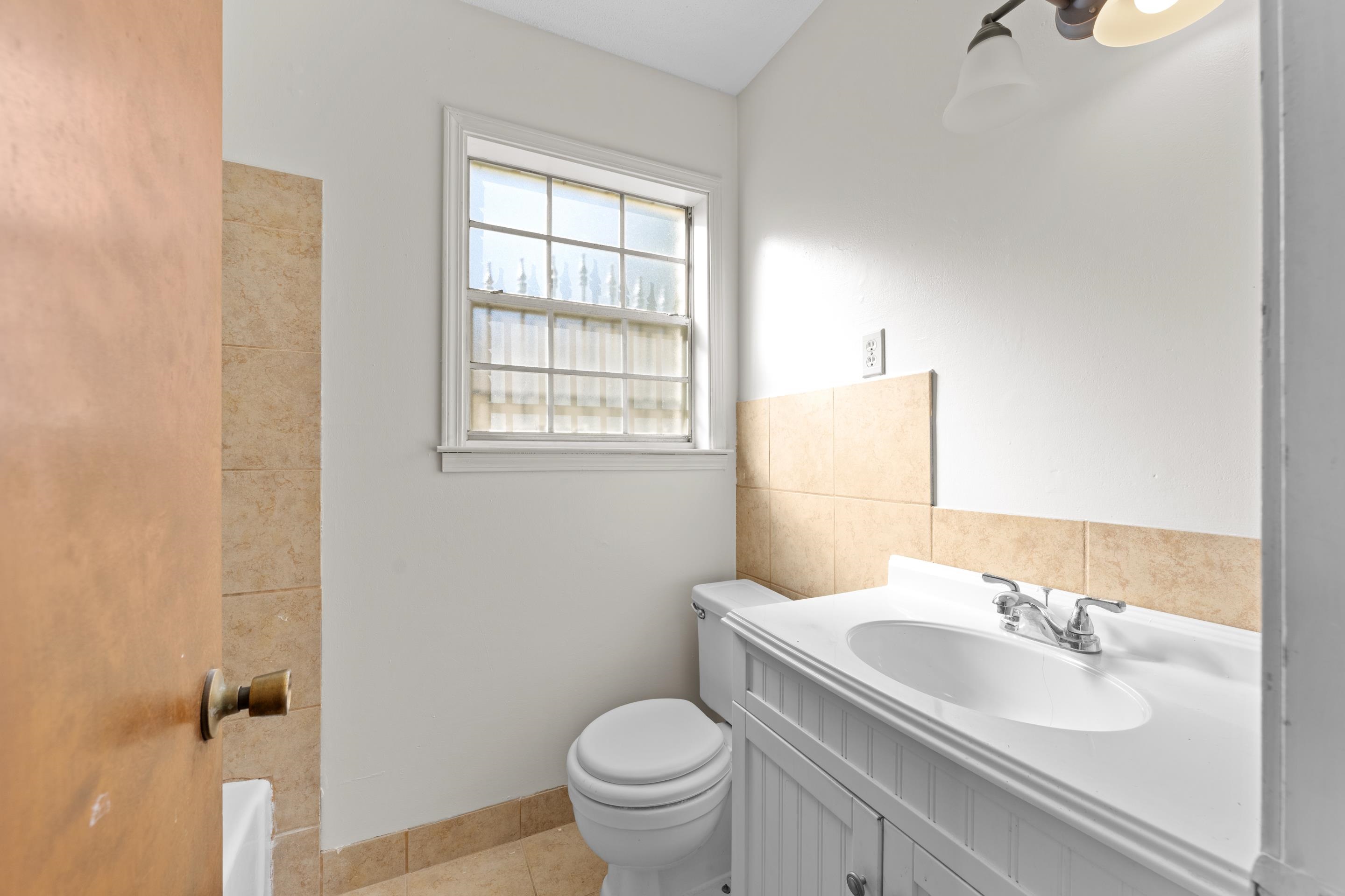 3095 Spring Hill Cove Memphis, TN 38127 - Photo 19 of 29 a bathroom with a sink toilet and a mirror