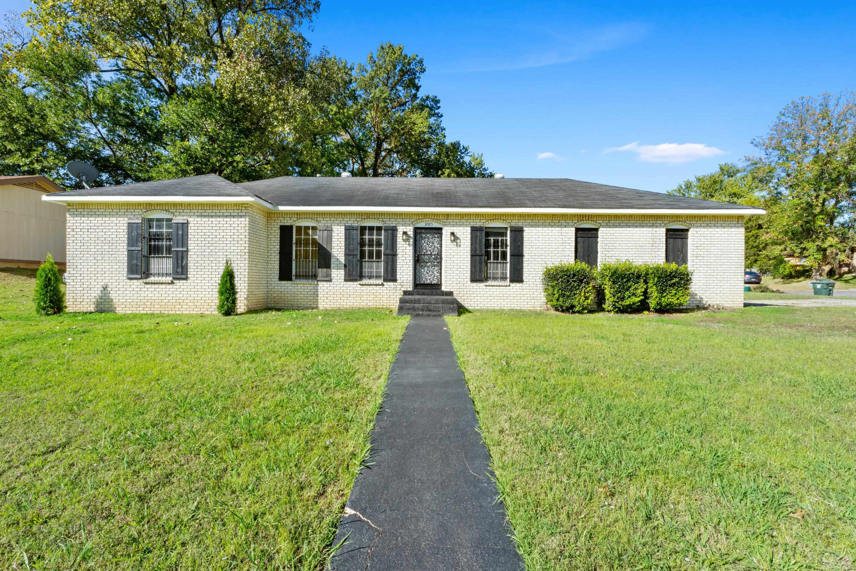 3095 Spring Hill Cove Memphis, TN 38127 - Photo 2 of 29 front view of a house with a yard