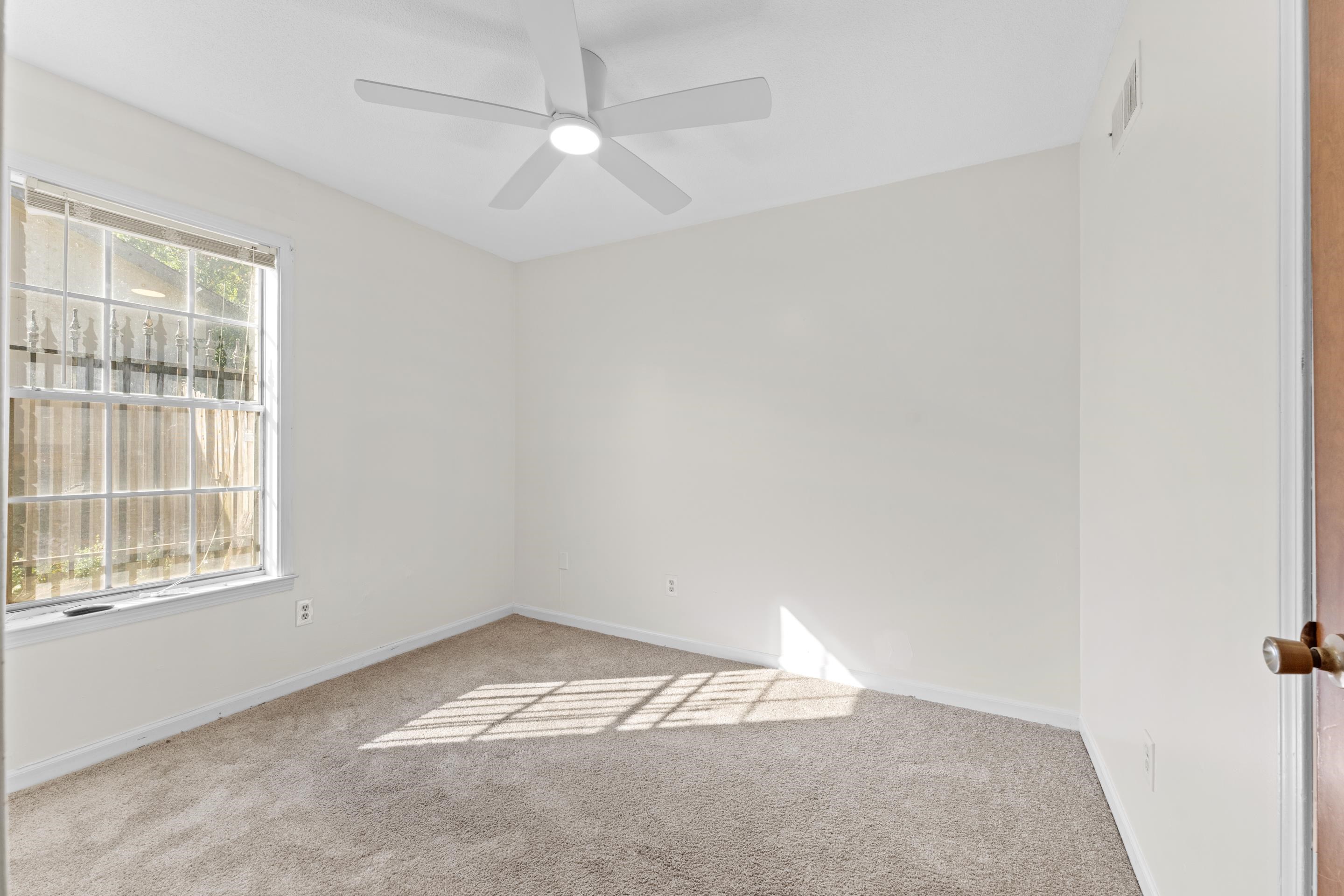 3095 Spring Hill Cove Memphis, TN 38127 - Photo 25 of 29 an empty room with a empty space and windows
